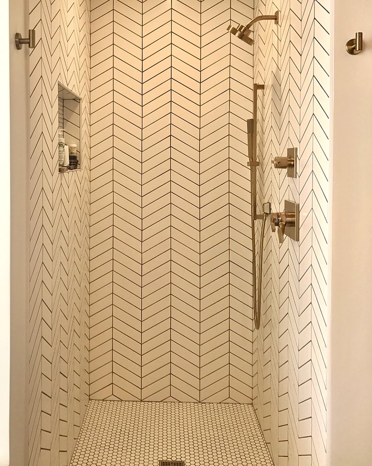 Chevron tile, brass fixtures